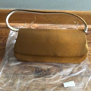 BRAND NEW BRONZE CLUTCH PURSE IT IS SMALL! NEW WITH TAGS ON IT! SMOKE FREE HOME